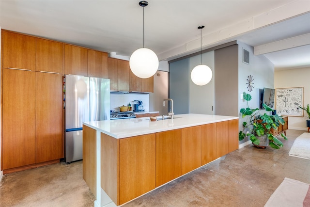 8820 Vinewood Dr, Dallas, TX 75228 - kitchen featuring freestanding refrigerator, brown cabinetry, light countertops, pendant lighting, and modern cabinets