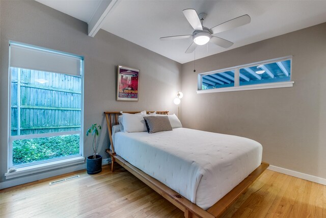 8820 Vinewood Dr, Dallas, TX 75228 - bedroom featuring wood finished floors, a ceiling fan, and beam ceiling