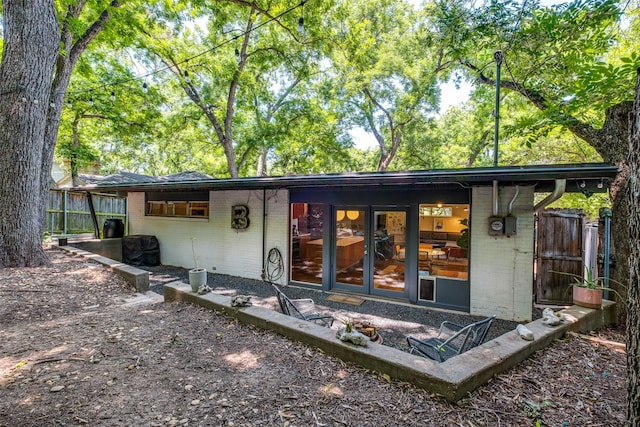 8820 Vinewood Dr, Dallas, TX 75228 - view of front facade featuring brick siding and french doors