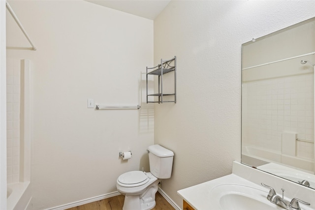 2409 Spruce Ct, Little Elm, TX 75068 - full bathroom featuring wood finished floors, vanity, and tub / shower combination