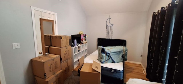 5782 Bayou Dr, Bossier City, LA 71112 - bedroom with vaulted ceiling and wood finished floors