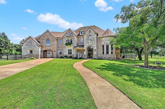 107 Bob Jones Ct, Pottsboro, TX 75076 - french country home with stone siding and concrete driveway