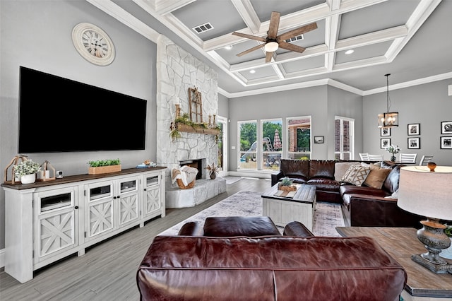 107 Bob Jones Ct, Pottsboro, TX 75076 - living room with light wood-style floors, ceiling fan, coffered ceiling, a fireplace, and beam ceiling