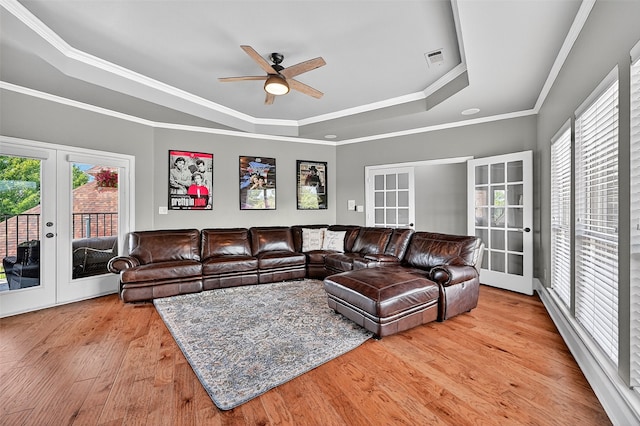 107 Bob Jones Ct, Pottsboro, TX 75076 - living room with french doors, a raised ceiling, light wood-type flooring, plenty of natural light, and ornamental molding