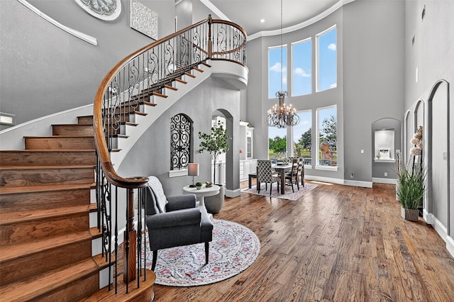 107 Bob Jones Ct, Pottsboro, TX 75076 - entryway with a high ceiling, stairs, wood finished floors, a chandelier, and ornamental molding