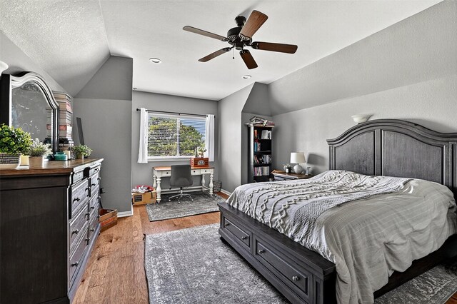 107 Bob Jones Ct, Pottsboro, TX 75076 - bedroom with vaulted ceiling, light wood-type flooring, a desk, and ceiling fan