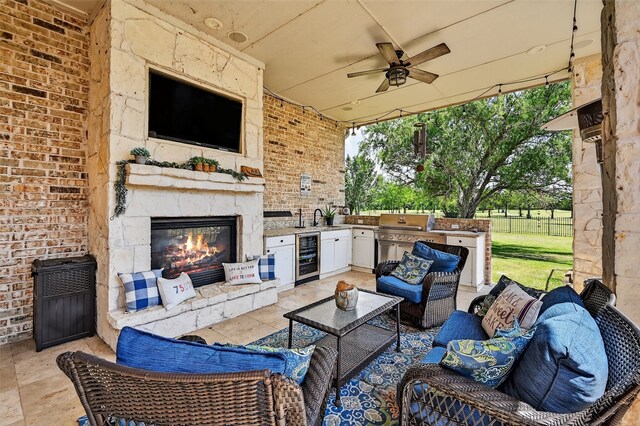 107 Bob Jones Ct, Pottsboro, TX 75076 - view of patio / terrace featuring wine cooler, an outdoor living space with a fireplace, an outdoor kitchen, and a ceiling fan