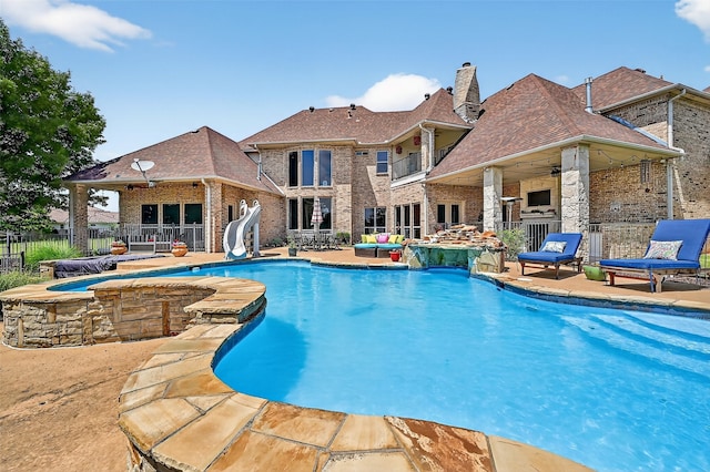 107 Bob Jones Ct, Pottsboro, TX 75076 - view of swimming pool with a water slide, a patio area, a jacuzzi, a ceiling fan, and outdoor lounge area