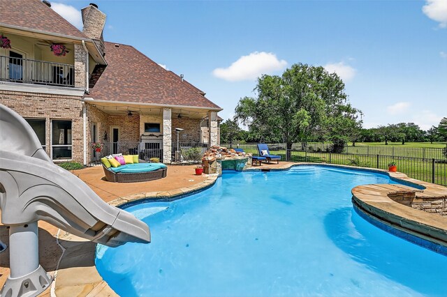 107 Bob Jones Ct, Pottsboro, TX 75076 - view of swimming pool with ceiling fan, a patio area, and a water slide