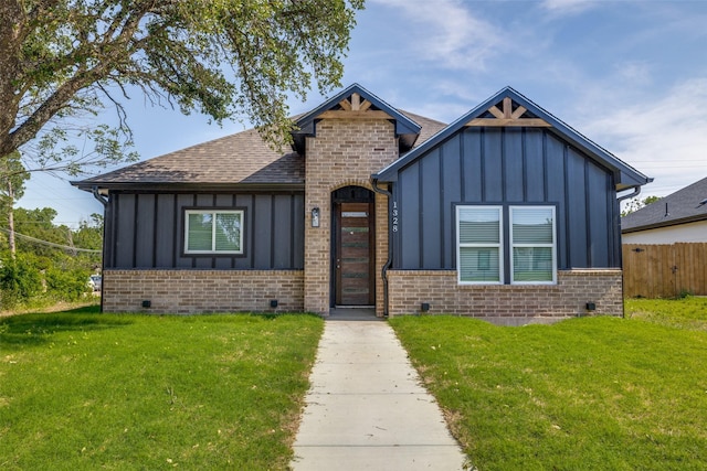 1328 Glasgow Rd, Fort Worth, TX 76134 - view of front of home with board and batten siding, brick siding, and roof with shingles