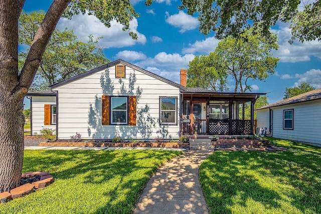 2504 Guilford Rd, Fort Worth, TX 76107 - view of front of property with a chimney and a front yard