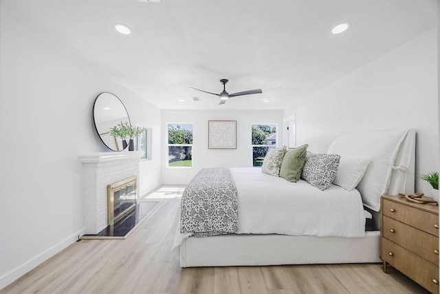 2504 Guilford Rd, Fort Worth, TX 76107 - bedroom with recessed lighting, wood finished floors, a brick fireplace, and a ceiling fan