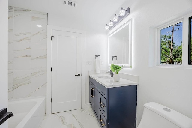 2504 Guilford Rd, Fort Worth, TX 76107 - full bath featuring marble look tile flooring, vanity, and shower / bath combination