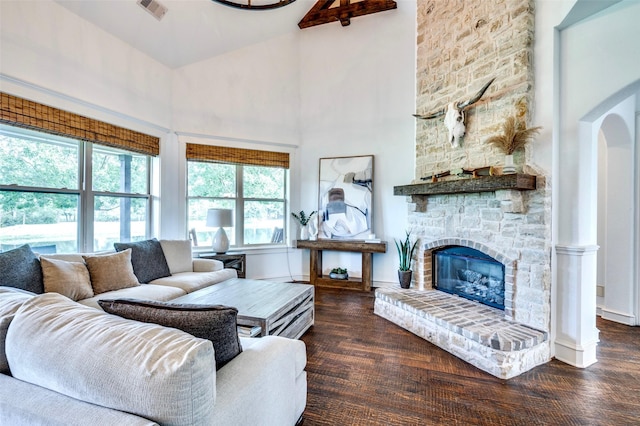 800 Manor Dr, Argyle, TX 76226 - living room with high vaulted ceiling, wood finished floors, a stone fireplace, and arched walkways