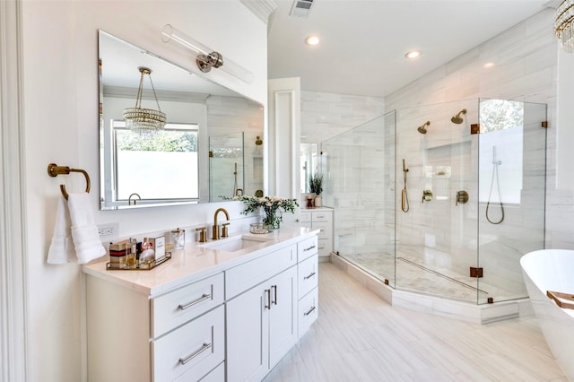 800 Manor Dr, Argyle, TX 76226 - full bathroom featuring vanity, a freestanding bath, a stall shower, recessed lighting, and a chandelier