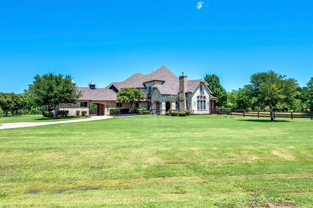800 Manor Dr, Argyle, TX 76226 - french provincial home featuring stone siding and a chimney