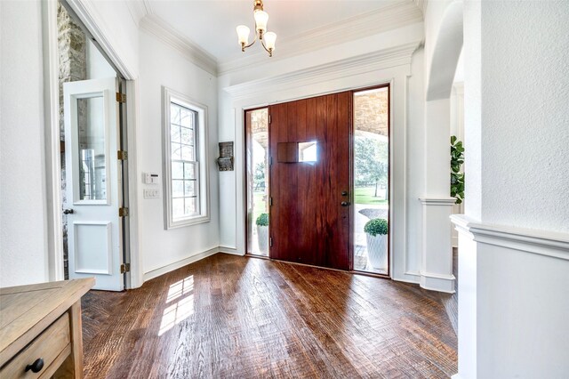 800 Manor Dr, Argyle, TX 76226 - entryway featuring a chandelier, dark wood-type flooring, and ornamental molding