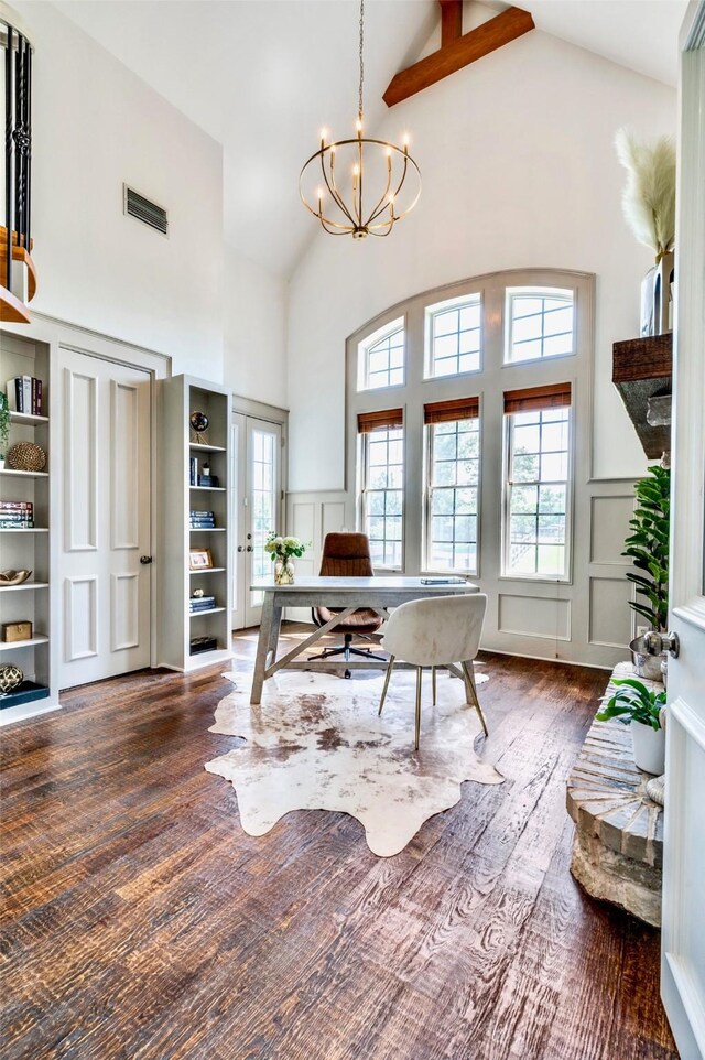 800 Manor Dr, Argyle, TX 76226 - office featuring high vaulted ceiling, a decorative wall, a chandelier, wood finished floors, and a wainscoted wall