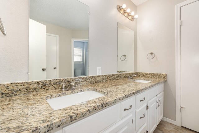 828 Whitehall Dr, Plano, TX 75023 - full bath featuring double vanity and toilet