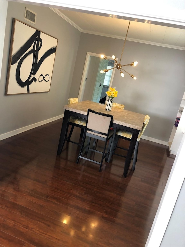 2848 Forest Ave, Fort Worth, TX 76112 - dining space featuring crown molding, dark wood-style flooring, and a chandelier