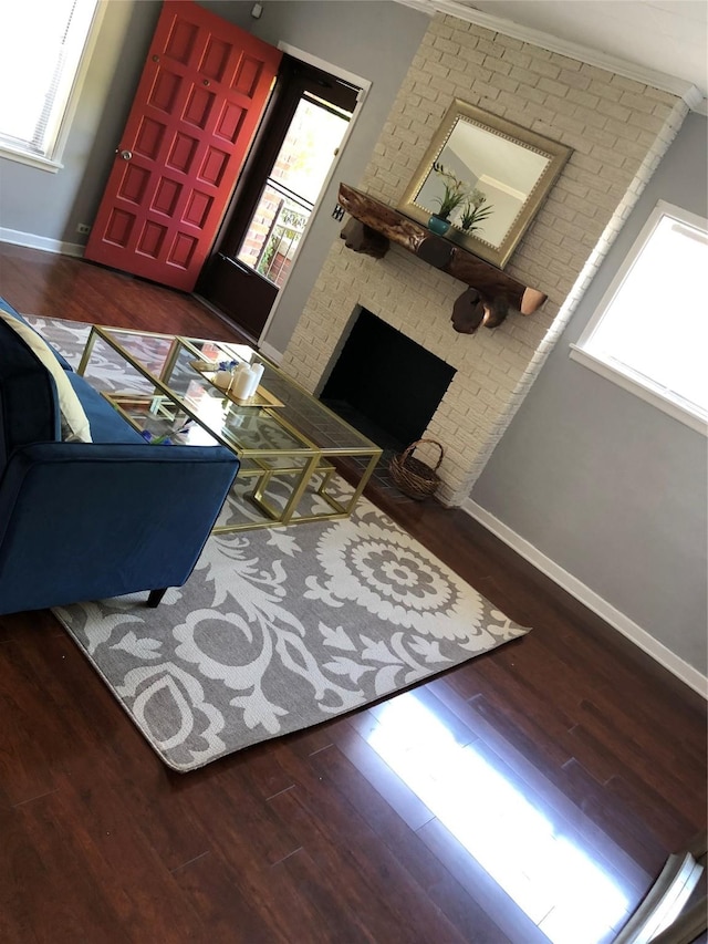 2848 Forest Ave, Fort Worth, TX 76112 - living area featuring wood finished floors, healthy amount of natural light, and a brick fireplace