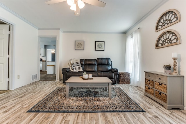 1105 Pyramid Dr, Garland, TX 75040 - living room featuring ceiling fan, wood finished floors, and ornamental molding