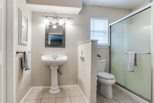 1105 Pyramid Dr, Garland, TX 75040 - bathroom featuring tile patterned floors and a shower stall
