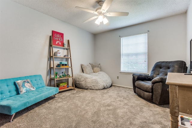 1105 Pyramid Dr, Garland, TX 75040 - sitting room featuring carpet, ceiling fan, and a textured ceiling