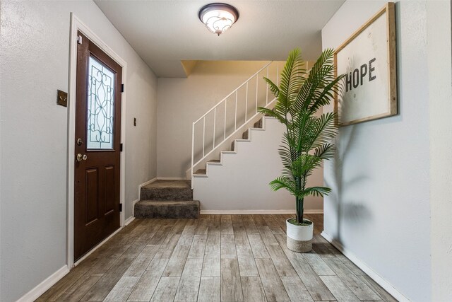 1105 Pyramid Dr, Garland, TX 75040 - foyer entrance with wood finished floors and stairs