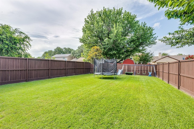 1105 Pyramid Dr, Garland, TX 75040 - fenced backyard with a trampoline