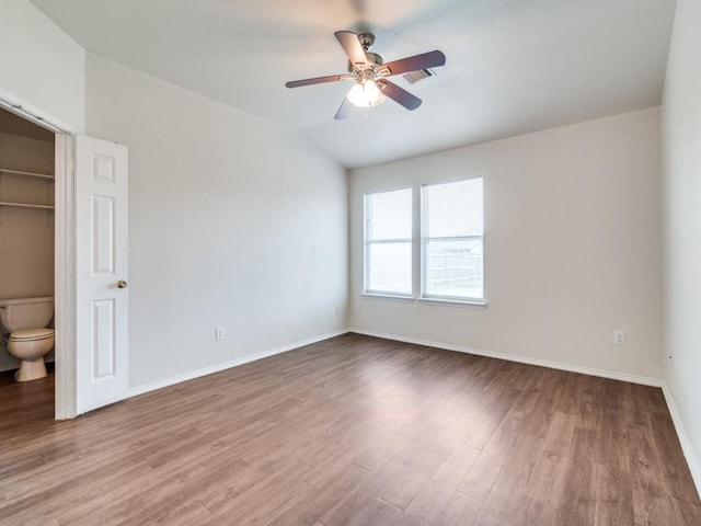 131 Freedom Trl, Forney, TX 75126 - unfurnished bedroom with wood finished floors, vaulted ceiling, and ceiling fan