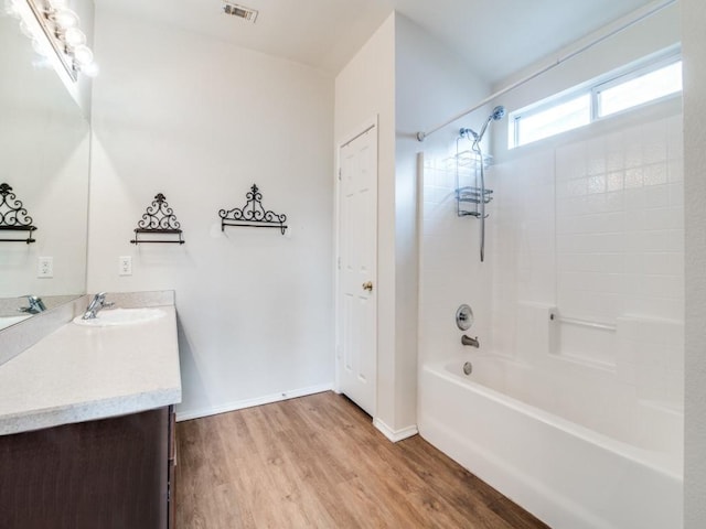 131 Freedom Trl, Forney, TX 75126 - bathroom featuring vanity, wood finished floors, and bathtub / shower combination