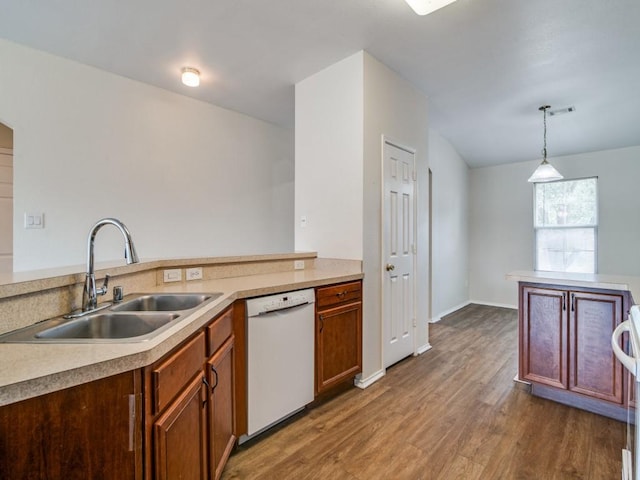 131 Freedom Trl, Forney, TX 75126 - kitchen with white dishwasher, light countertops, wood finished floors, pendant lighting, and brown cabinets