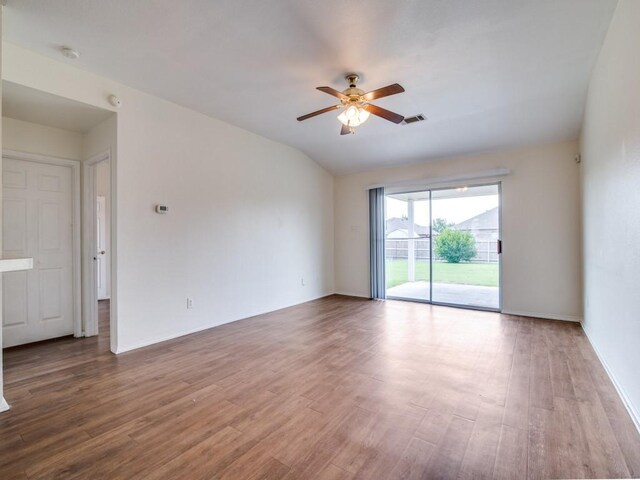 131 Freedom Trl, Forney, TX 75126 - spare room featuring a ceiling fan, wood finished floors, vaulted ceiling, and a smoke detector