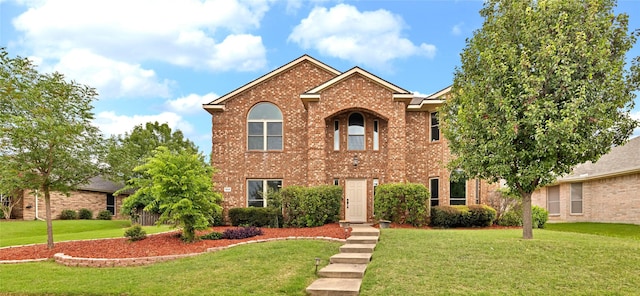1645 Ashbourne Dr, Rockwall, TX 75087 - view of front of house with a front lawn and brick siding