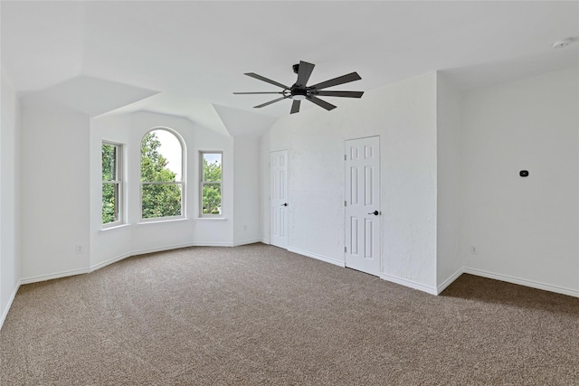 1645 Ashbourne Dr, Rockwall, TX 75087 - carpeted spare room featuring ceiling fan, lofted ceiling, and a smoke detector