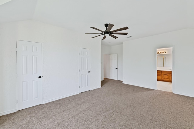 1645 Ashbourne Dr, Rockwall, TX 75087 - unfurnished bedroom with light carpet, ensuite bath, vaulted ceiling, and a ceiling fan