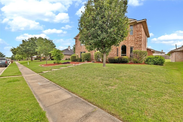 1645 Ashbourne Dr, Rockwall, TX 75087 - view of front of home with brick siding and a front lawn