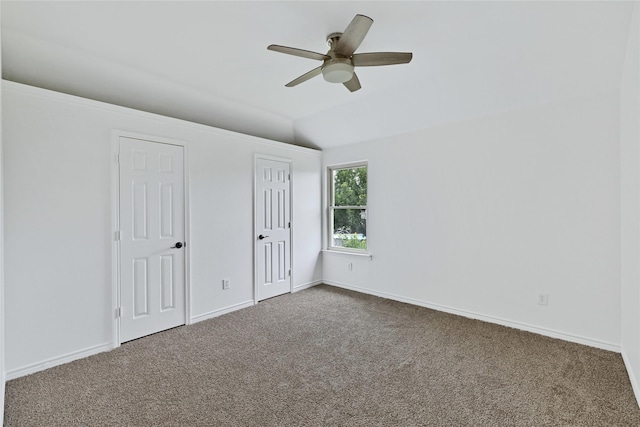 1645 Ashbourne Dr, Rockwall, TX 75087 - unfurnished bedroom featuring carpet, vaulted ceiling, multiple closets, and ceiling fan