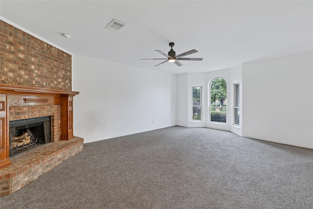 1645 Ashbourne Dr, Rockwall, TX 75087 - unfurnished living room with a ceiling fan, carpet flooring, and a brick fireplace
