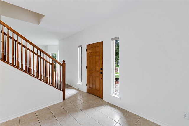 1645 Ashbourne Dr, Rockwall, TX 75087 - foyer entrance featuring stairs and light tile patterned floors