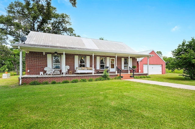 1243 Vz County Road 1903, Fruitvale, TX 75127 - view of front of property featuring covered porch, a garage, a front lawn, a metal roof, and brick siding