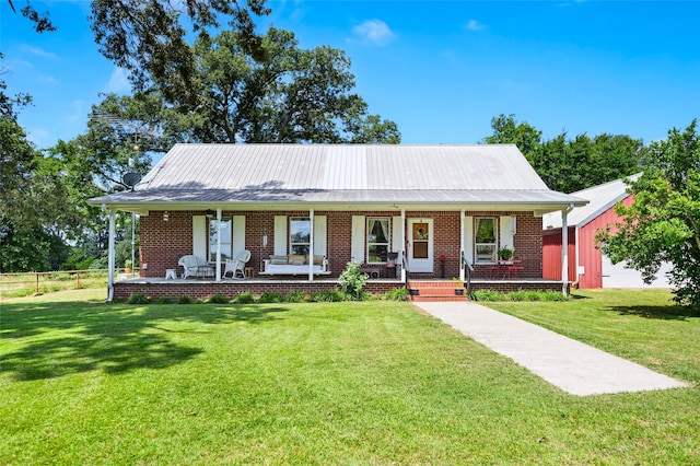 1243 Vz County Road 1903, Fruitvale, TX 75127 - view of front of property featuring a porch, a front yard, a metal roof, and brick siding