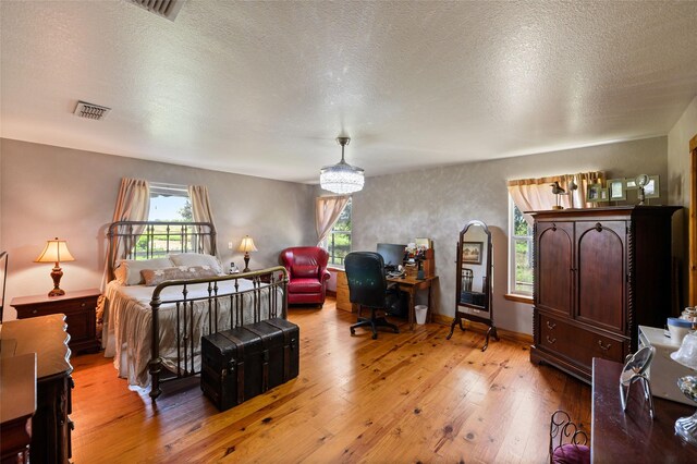 1243 Vz County Road 1903, Fruitvale, TX 75127 - bedroom featuring light wood-style floors and a textured ceiling
