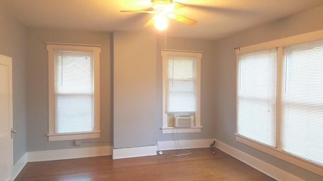 111 N Winnetka Ave, Dallas, TX 75208 - spare room with cooling unit, a ceiling fan, and wood finished floors