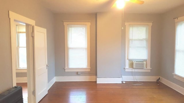 111 N Winnetka Ave, Dallas, TX 75208 - unfurnished room featuring cooling unit, wood finished floors, and ceiling fan