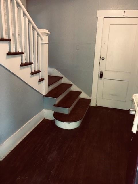 111 N Winnetka Ave, Dallas, TX 75208 - stairway featuring wood finished floors and baseboards