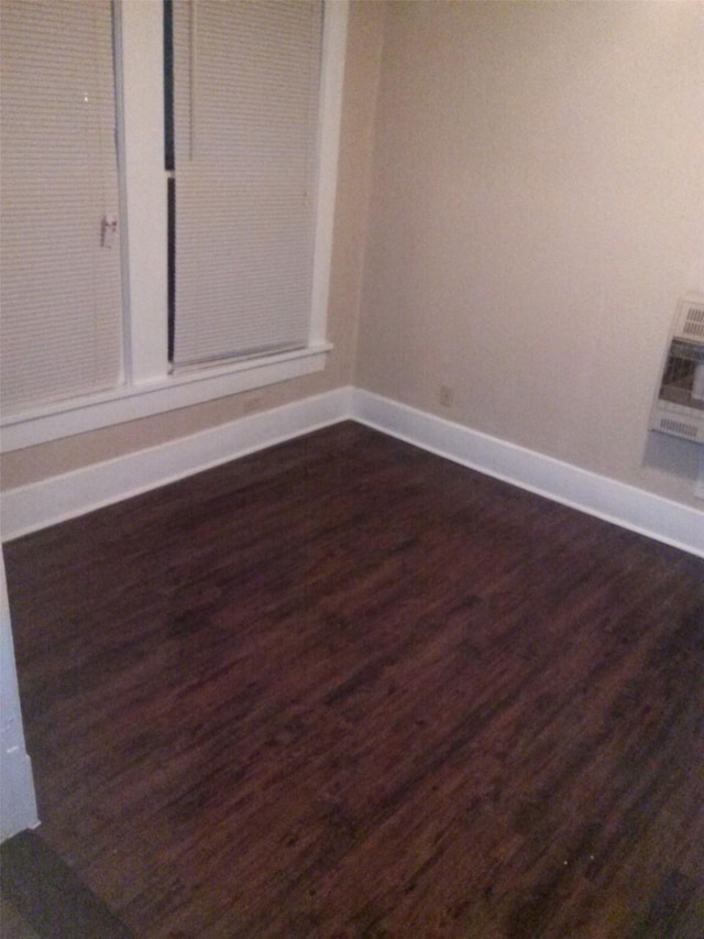 111 N Winnetka Ave, Dallas, TX 75208 - unfurnished room with dark wood-type flooring