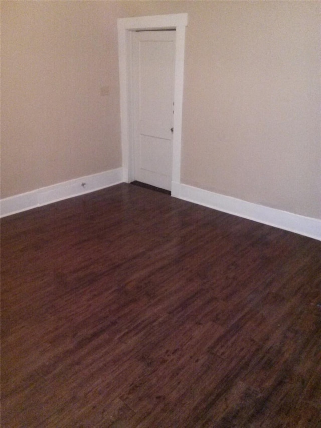 111 N Winnetka Ave, Dallas, TX 75208 - empty room with dark wood-style flooring
