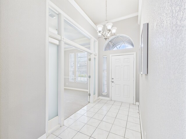 1197 Pleasant Oaks Dr, Lewisville, TX 75067 - entrance foyer with ornamental molding, a chandelier, light tile patterned floors, and a textured wall
